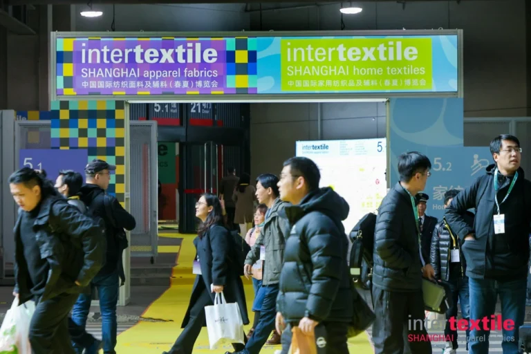 algo bert fashion intertextile shanghai fabric expo booth - colorful fabric displays at supplier booth with various textile samples